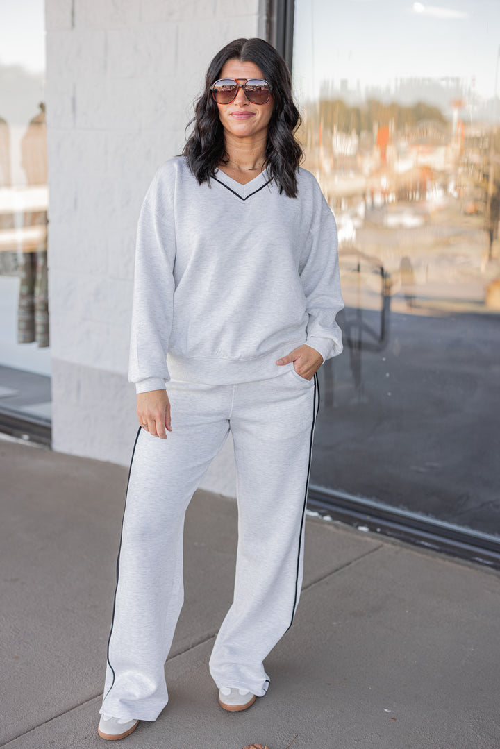 Women's heather grey scuba knit straight leg elastic waist pants by Rae Mode showing full front view