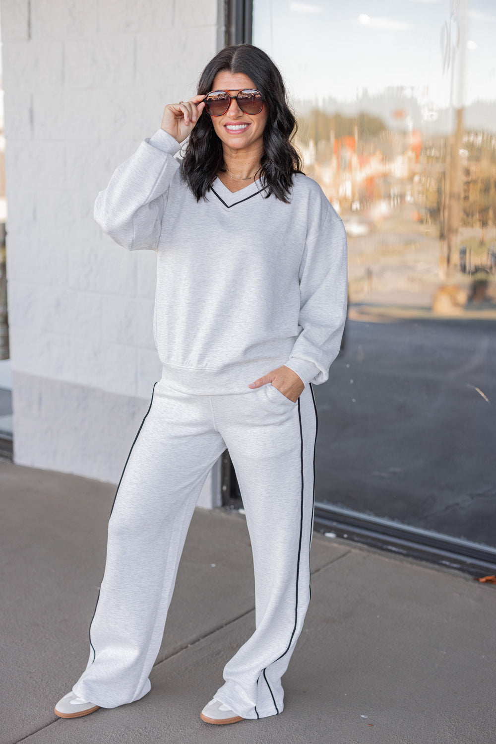 Women's grey and black striped piping scuba knit top by Rae Mode shown with matching outit