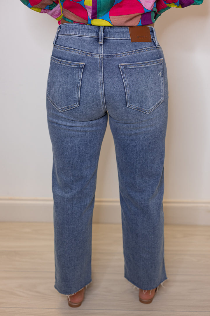 Hidden Jeans Tracy hem slit cropped straight jeans in medium dark denim showing back view