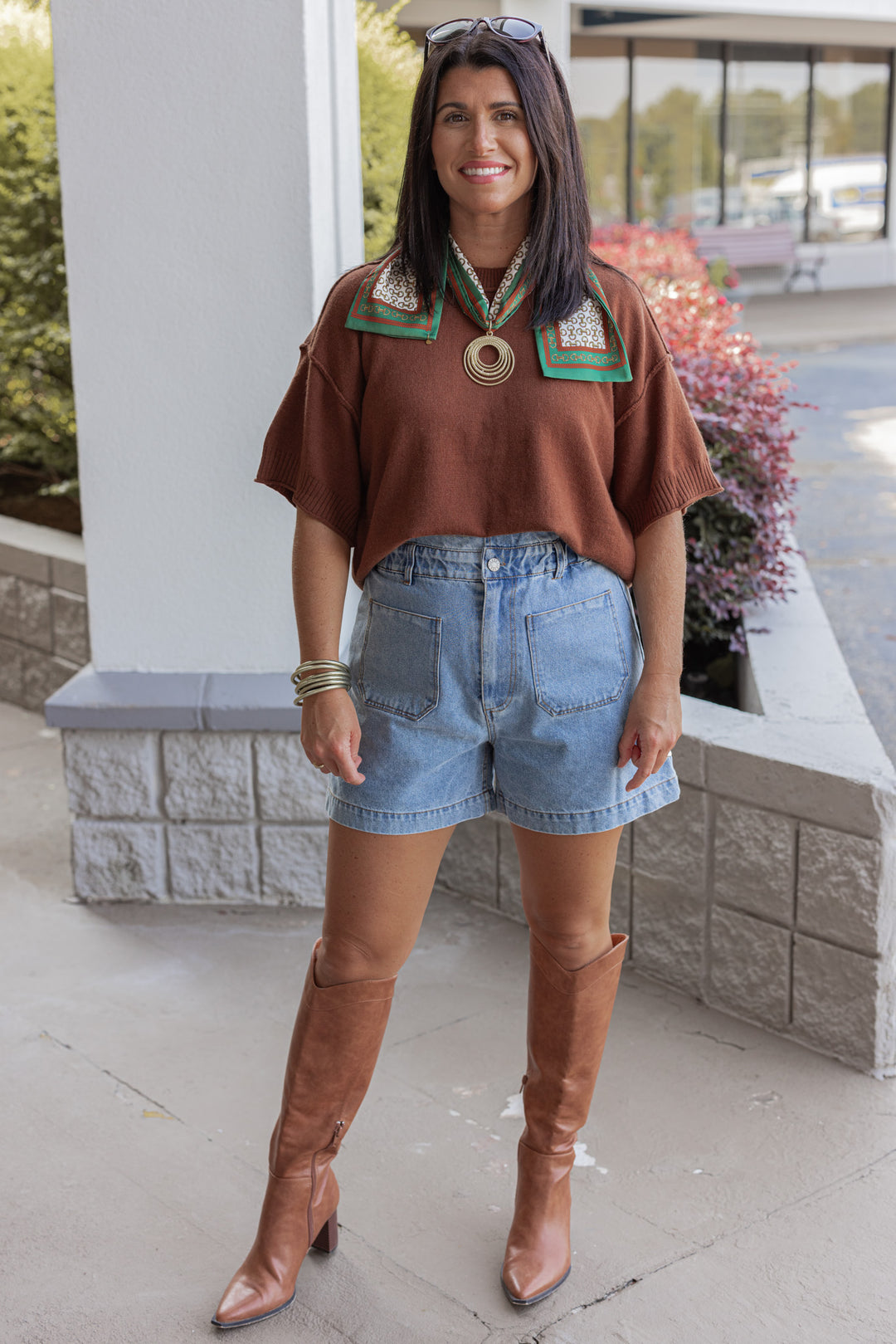 Blue high rise denim shorts with ruffle trimmed waistband by Hidden showing full front view