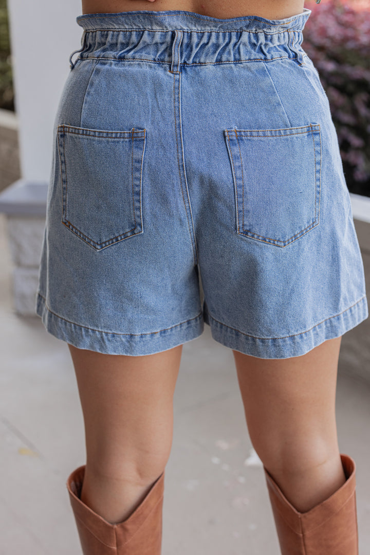 Blue high rise denim shorts with ruffle trimmed waistband by Hidden showing up close back view