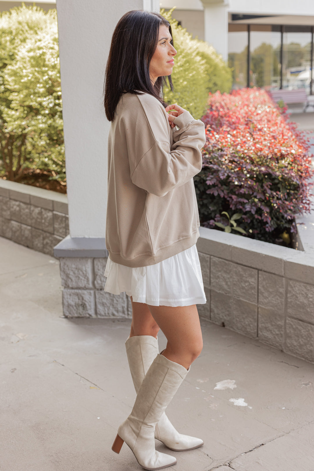 Women's taupe terry knit pullover sweatshirt with a white horseshoe on front by Wishlist showing full side view
