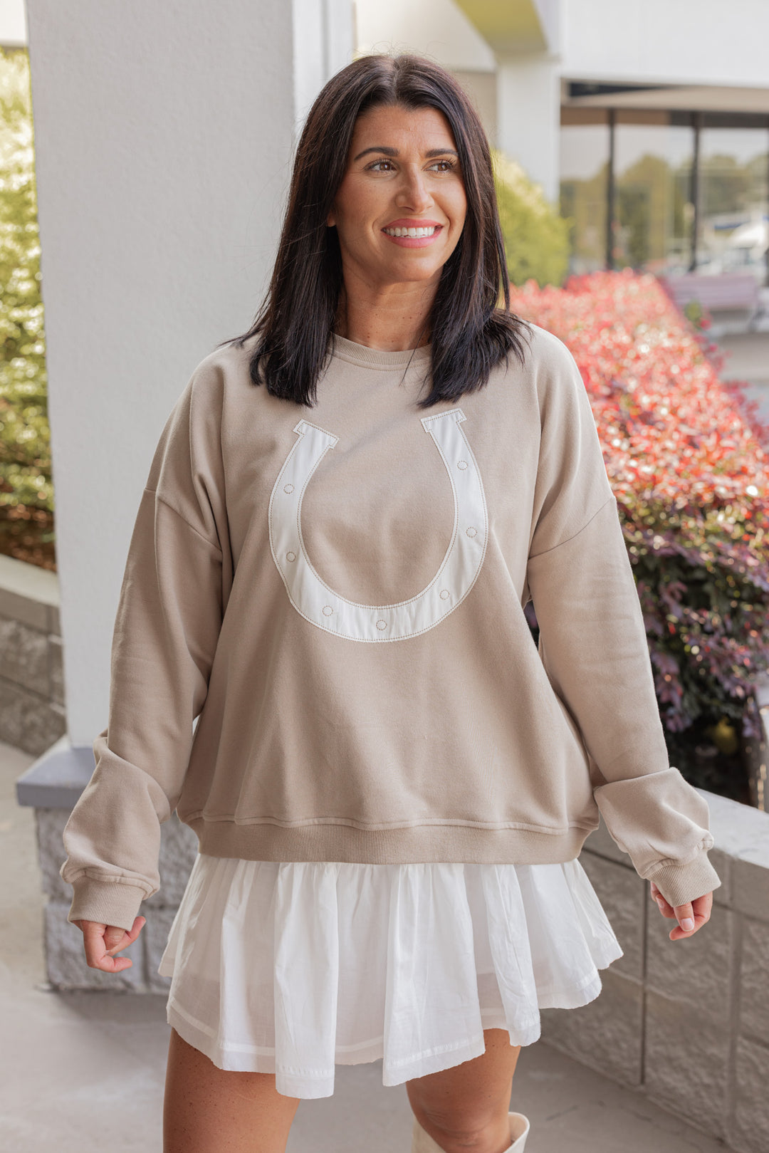 Women's taupe terry knit pullover sweatshirt with a white horseshoe on front by Wishlist showing up close front view