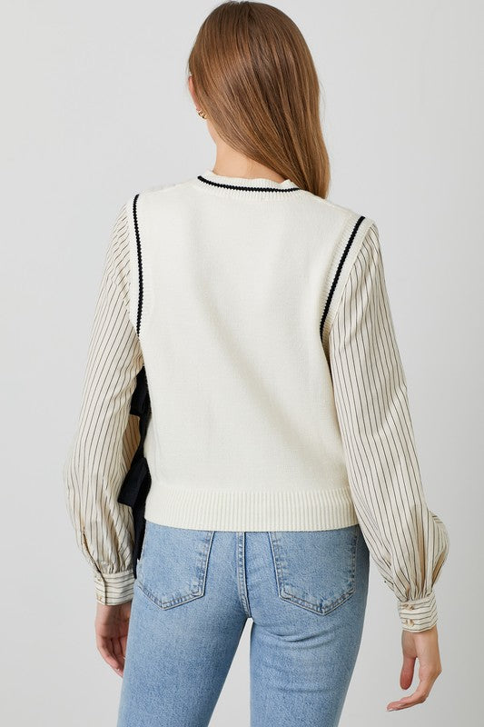 Polagram BaeVely Ivory and black sweater vest with bow tie details over faux ivory and black top