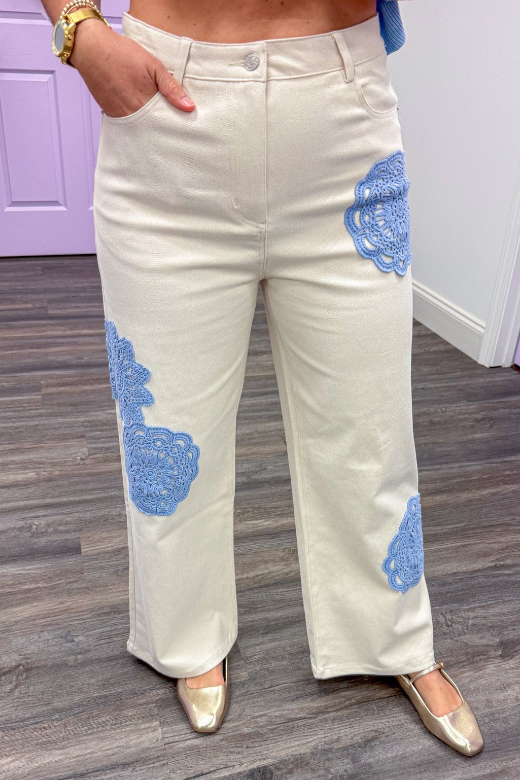 cream twill blue embroidery detail wide leg pants up close