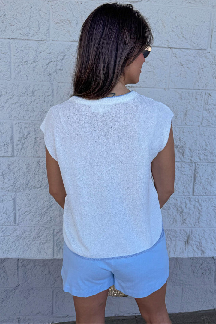beachy ivory with light blue seahorse detail sleeveless knit top