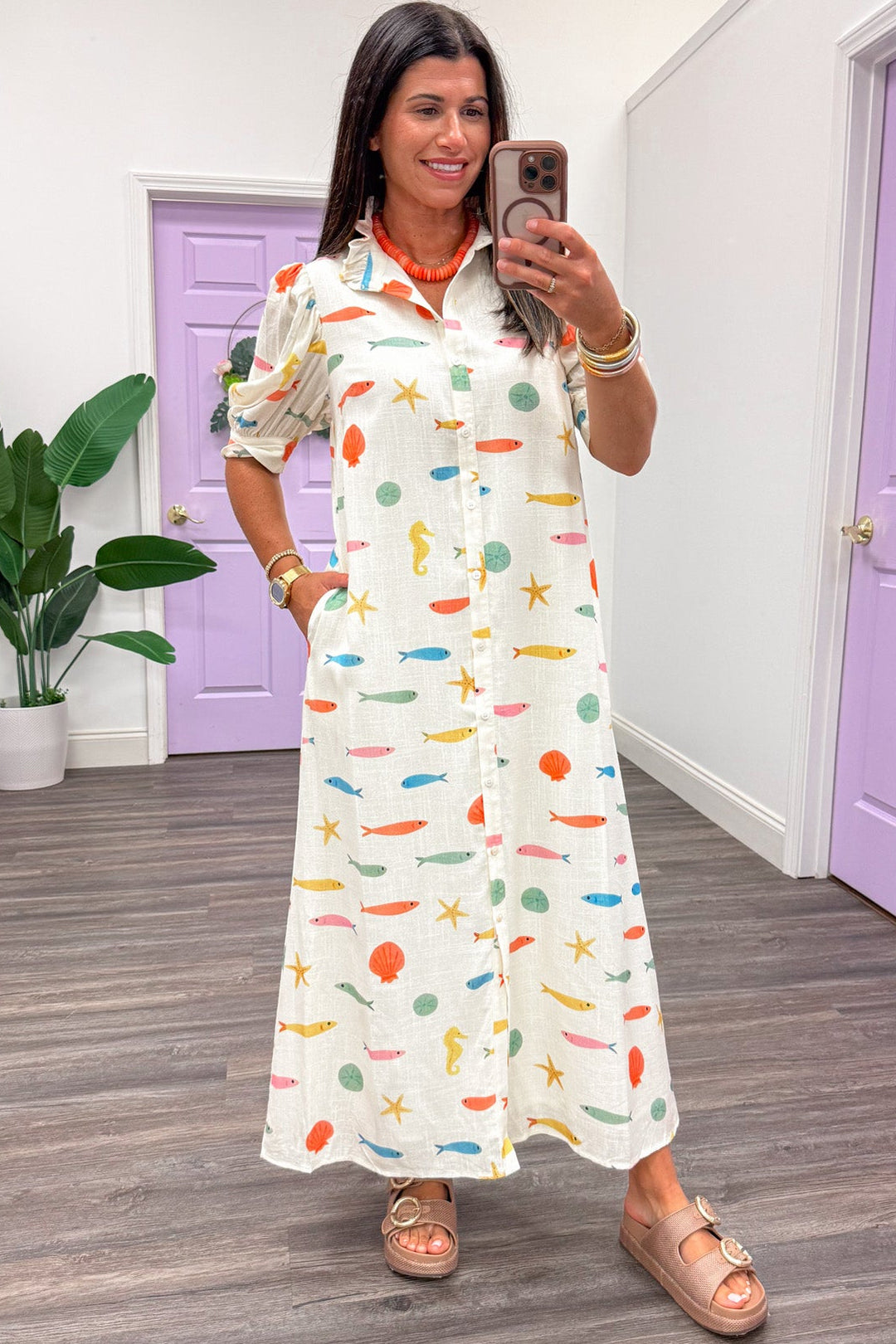 ivory with multicolored fish and seashell print short sleeve button front maxi dress