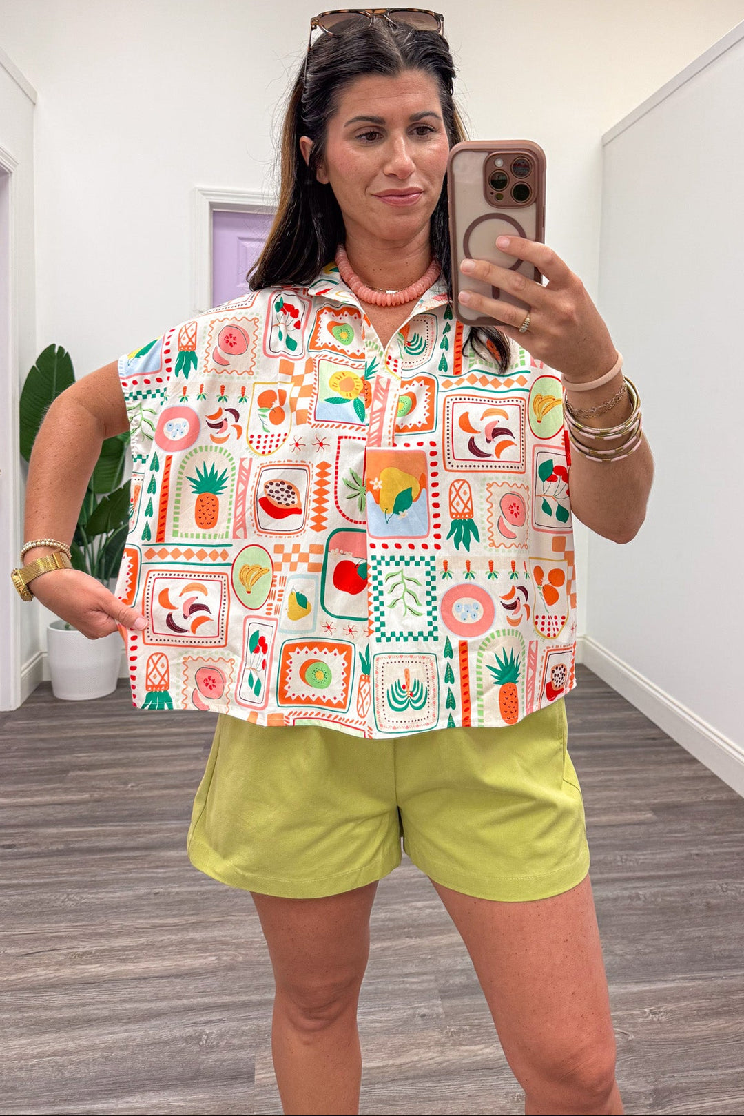ivory with multi-colored fruit basket print short sleeve v neck relaxed silhouette cotton top