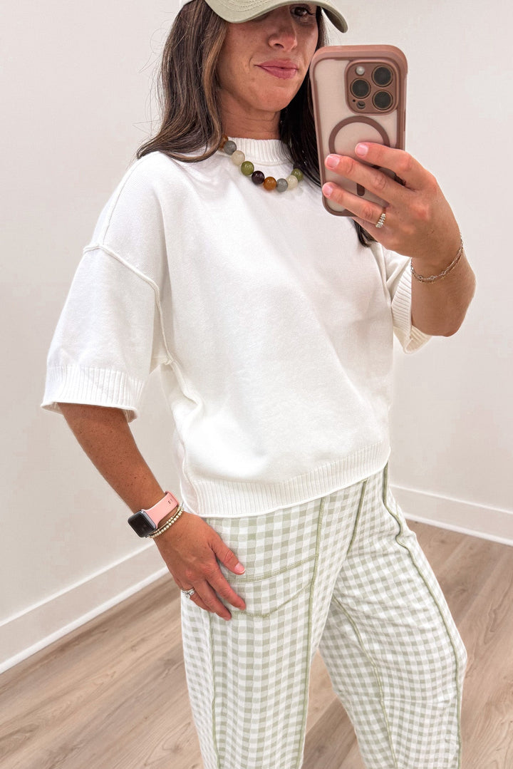solid ivory half length sleeve crew neckline semi-cropped lightweight knit sweater top