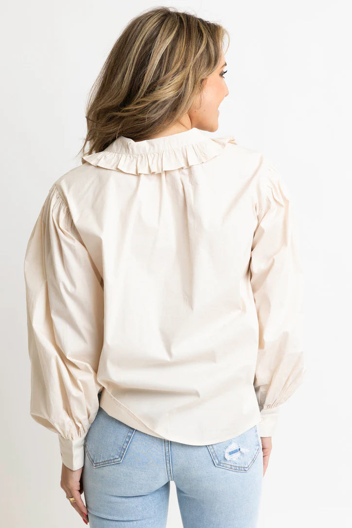 Women's ivory button front top with ruffle trim details by Karlie showing back view