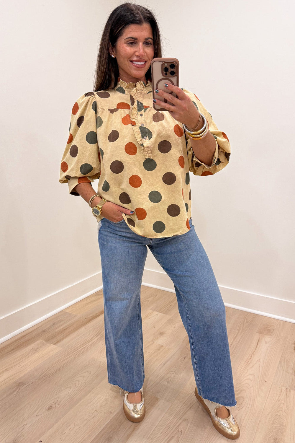 khaki with orange brown and green polka dot print button front bodice puff sleeve top with ruffled details