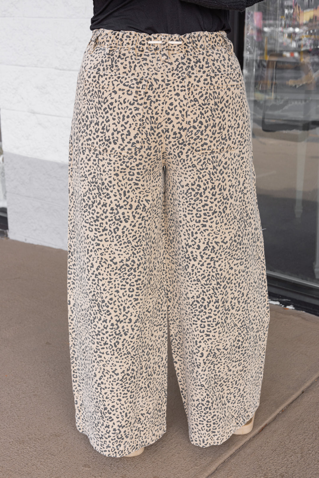 Women's tan and black leopard print denim wide leg pants with drawstring waist by Mustard Seed showing up close back view