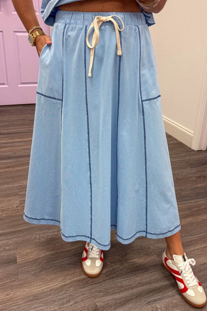 light blue with navy reverse seam details top and side pocket midi skirt set