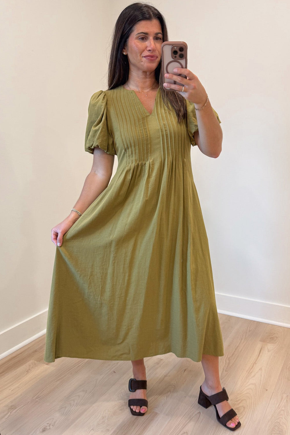 solid light olive green puff sleeve v neckline pleated bodice relaxed silhouette midi dress