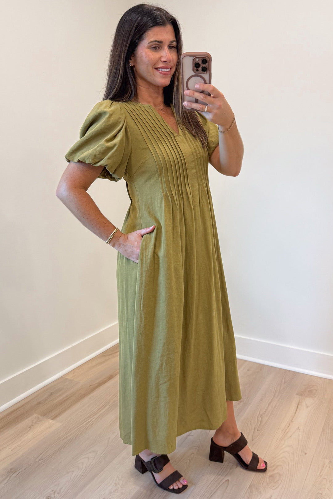solid light olive green puff sleeve v neckline pleated bodice midi dress with side pockets
