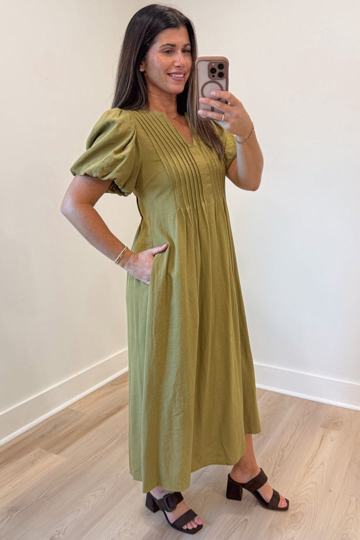 solid light olive green puff sleeve v neckline pleated bodice midi dress with side pockets