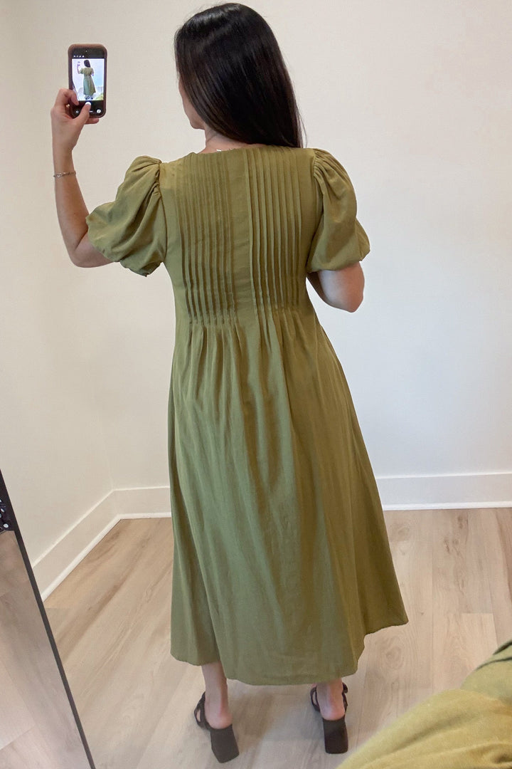 solid light olive green puff sleeve v neckline pleated bodice flowy midi dress