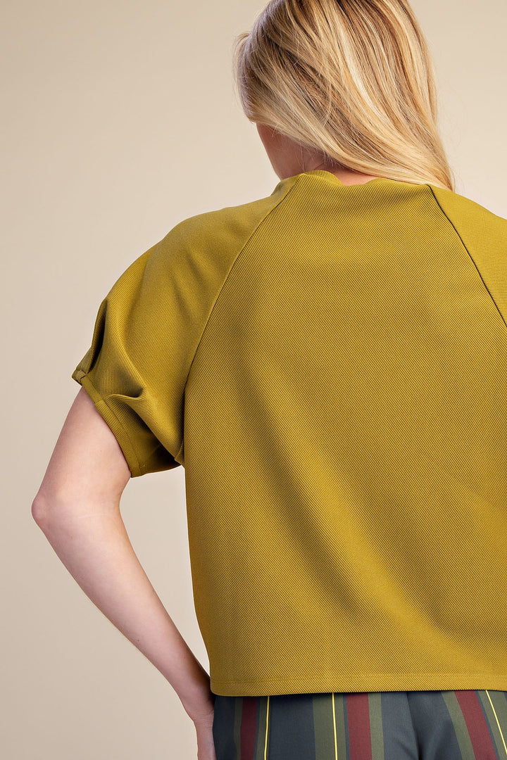 Light olive textured knit top with gathered puff sleeves in a flattering silhouette