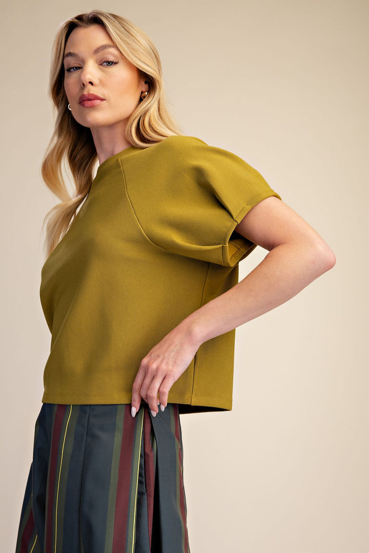 Light olive textured knit top with gathered puff sleeves in a cropped style