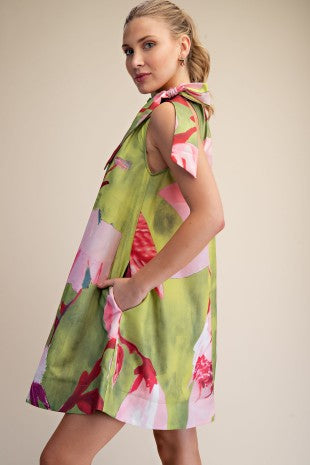 Lime and pink floral print mini dress with adjustable drawstring bow tie neck by Glam with side pockets