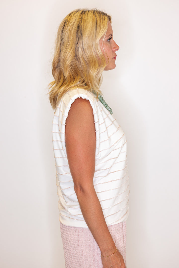 Cream sleeveless knit top with ombre taupe textured wave stripes by Strut and Bolt showing side view