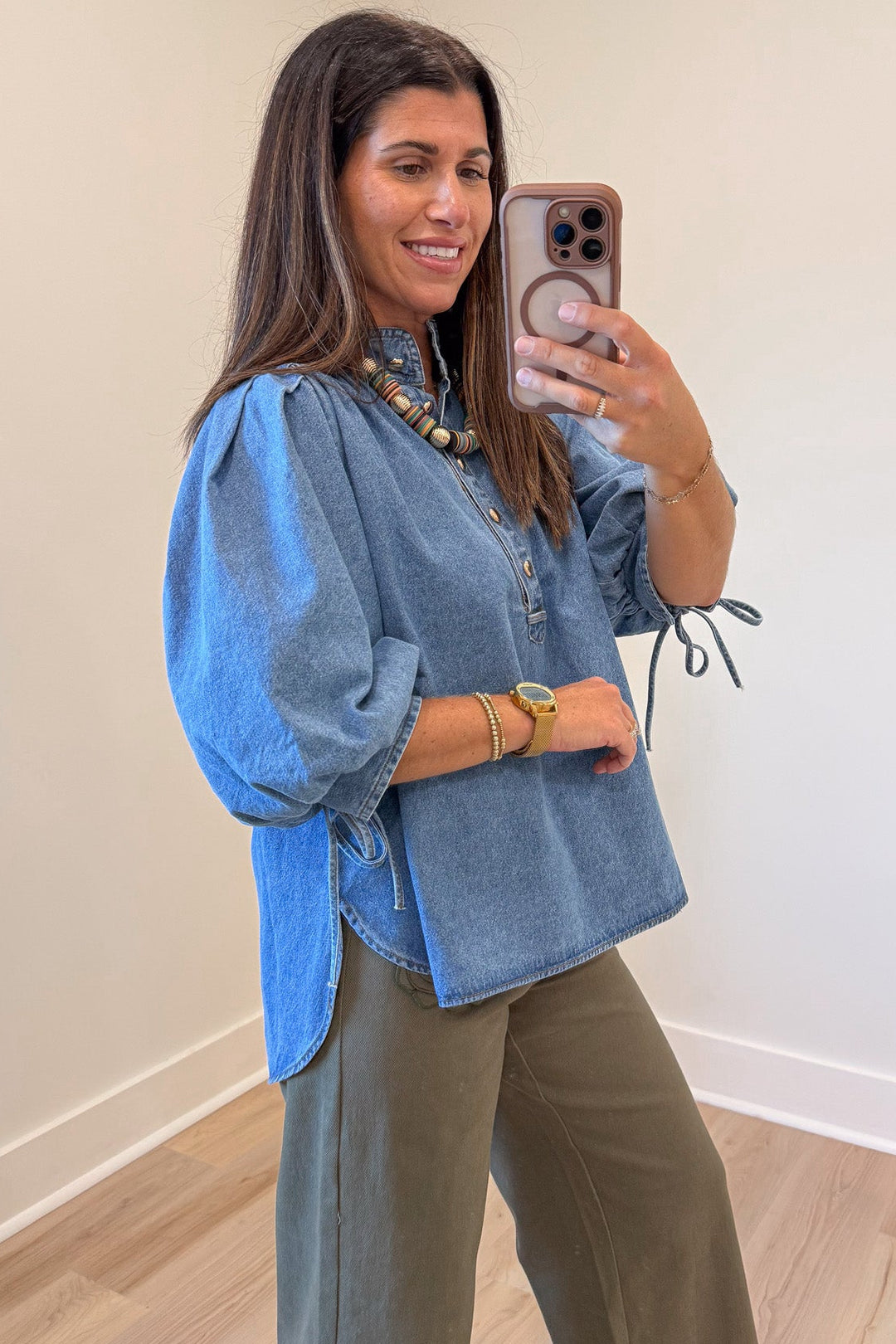 solid medium blue denim button front bodice self-tie cuffed 3/4 length puff sleeve top