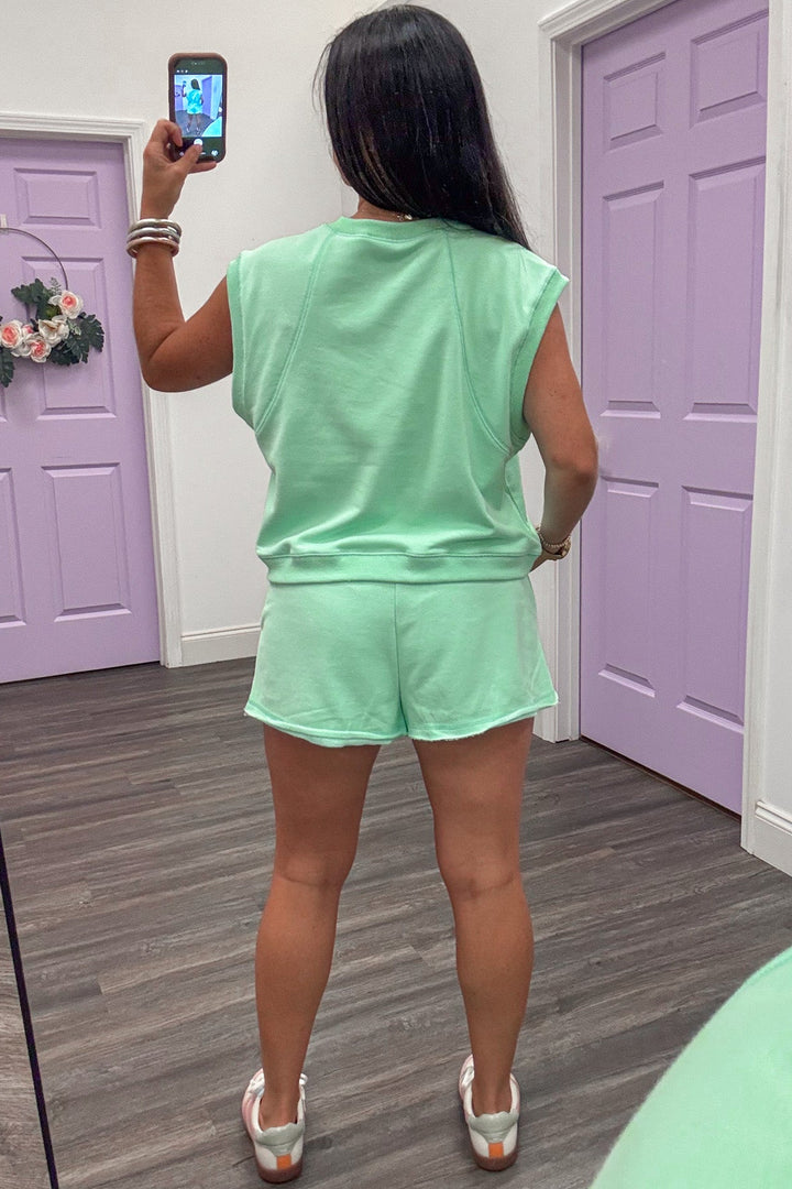 mint green reverse seam muscle tank top and raw hem shorts matching terry knit athleisure set
