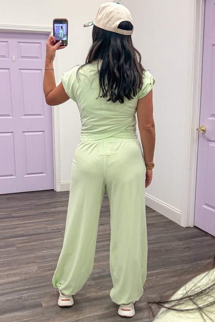 solid mint green sleeveless crossover waist top and jogger pants matching athleisure set