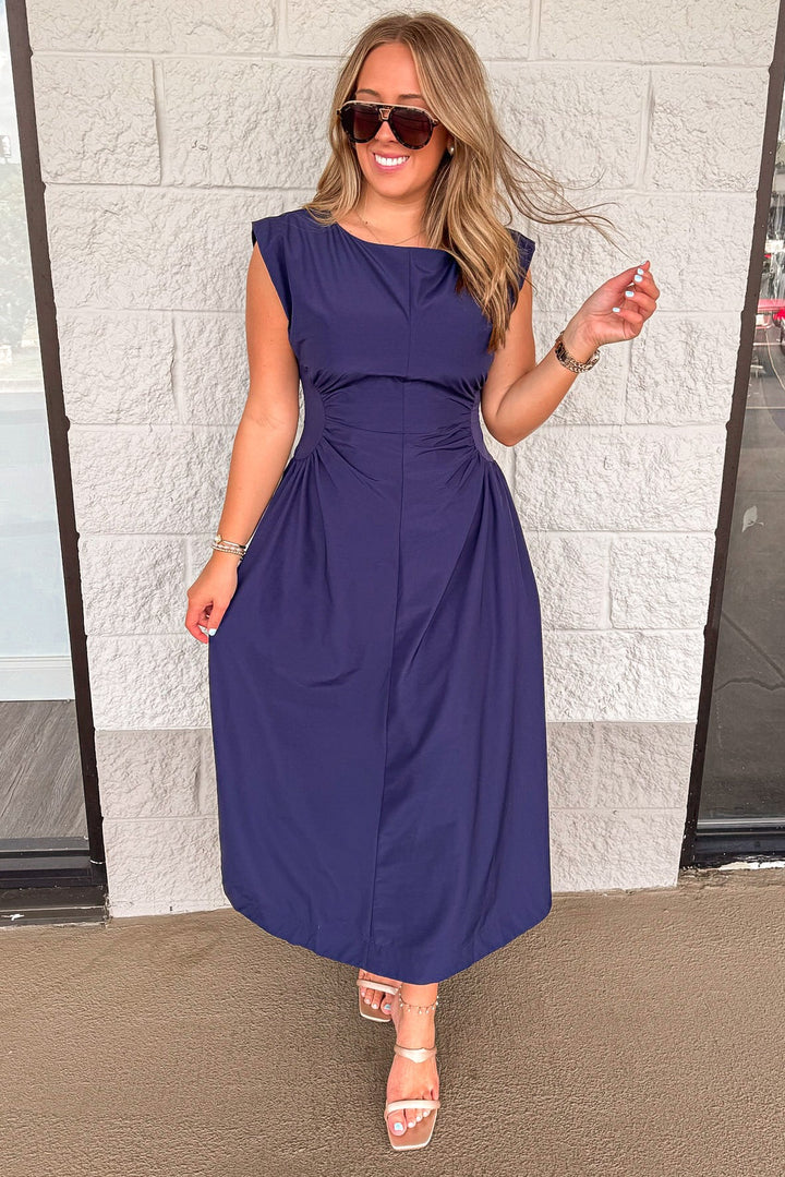 solid navy blue cinched waist sleeveless midi dress with flowy skirt
