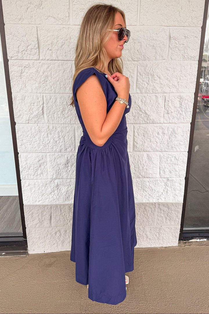 solid navy blue cinched waist sleeveless midi dress with side pockets
