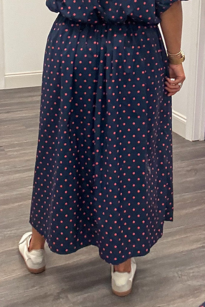 navy blue with coral polka dot print elastic waist cotton poplin midi skirt back view