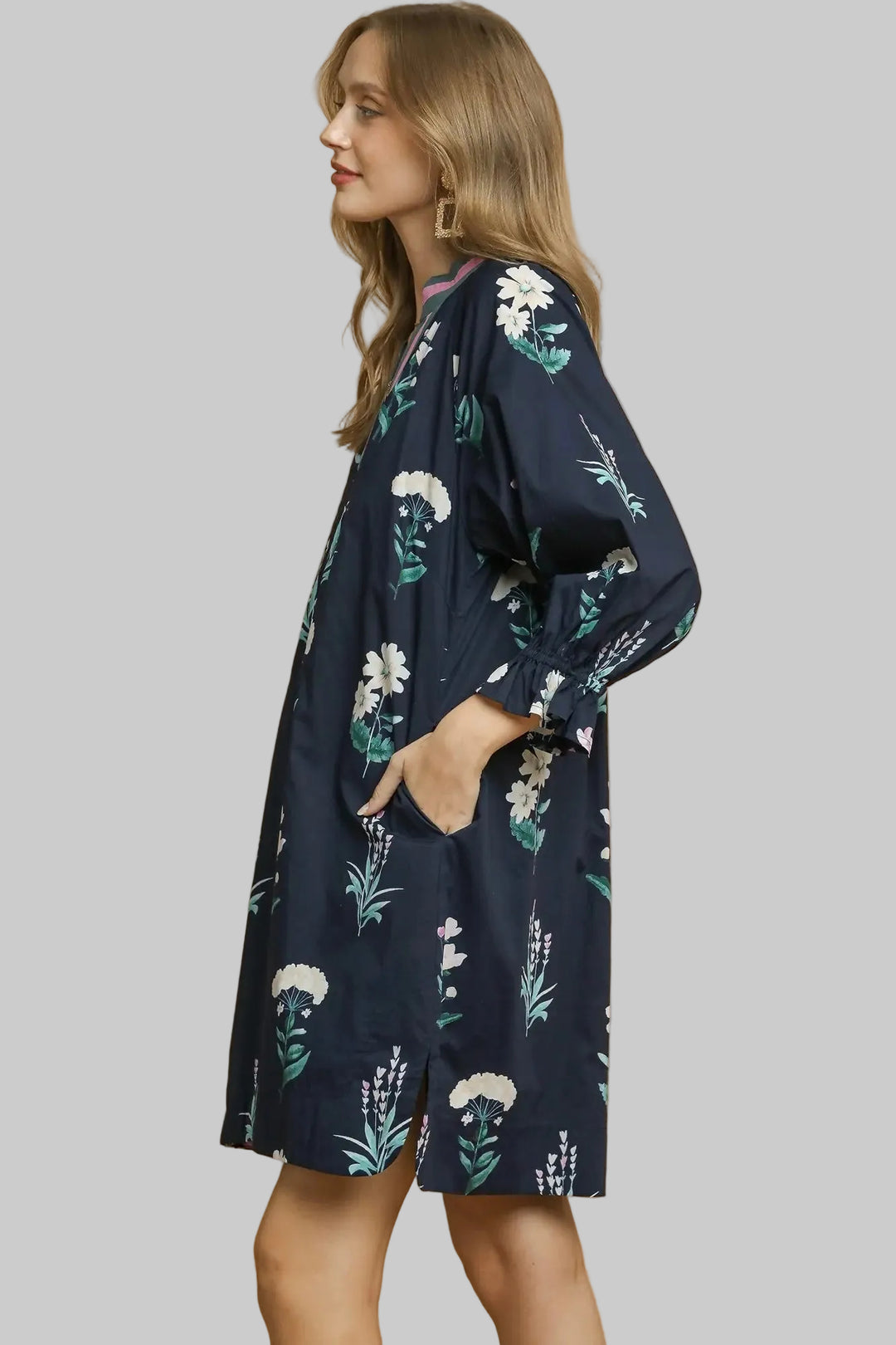 Women's Umgee navy dress with pink and sage green floral print showing side view