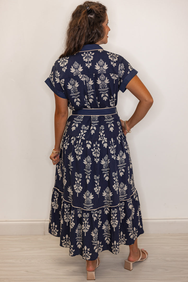 back view of Women's navy floral print belted midi dress