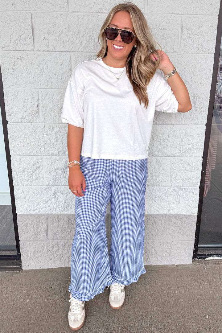 dark blue and ivory gingham checkered print ruffle hem wide leg pants