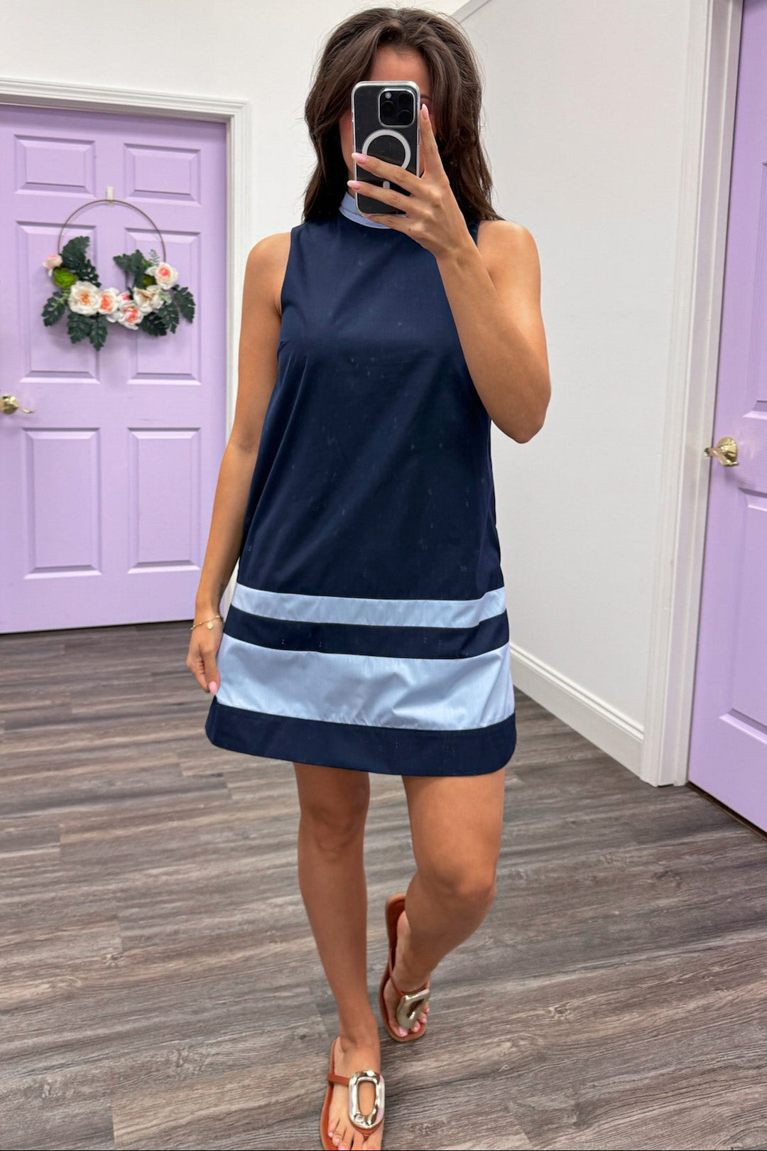 navy sleeveless mini dress with light blue banded trim detail