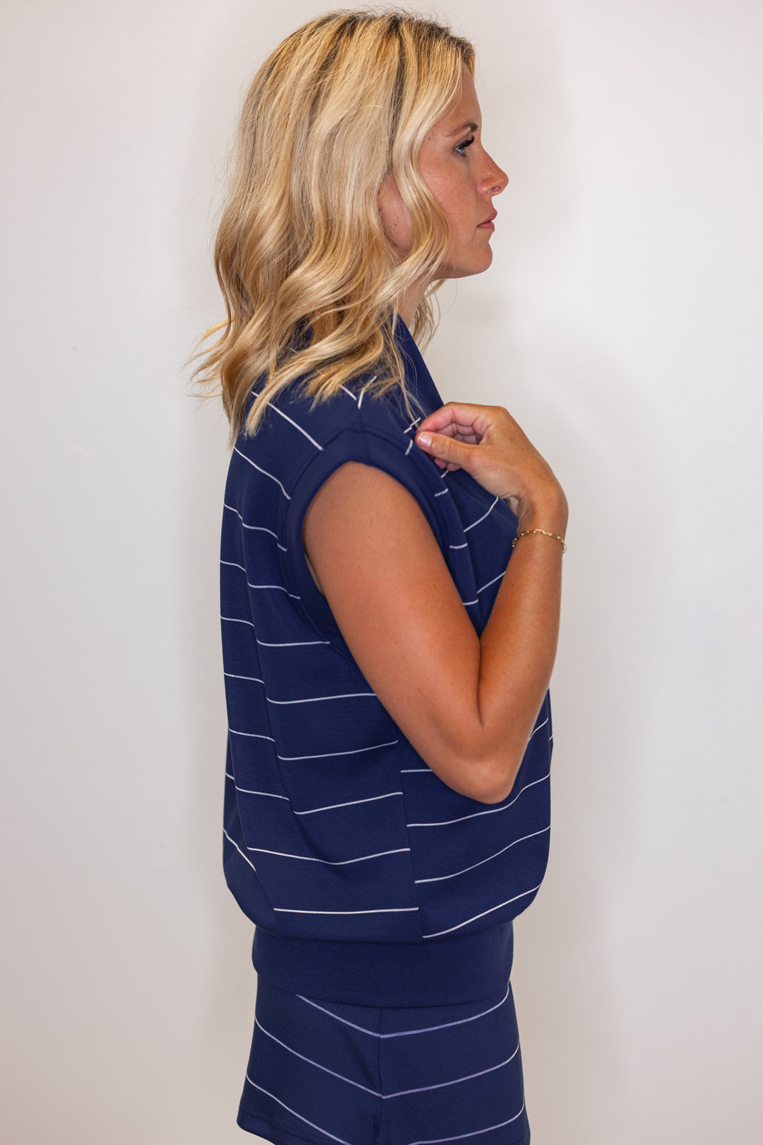 Women's smoky navy and cream striped scuba knit sleeveless top by Rae Mode showing side view
