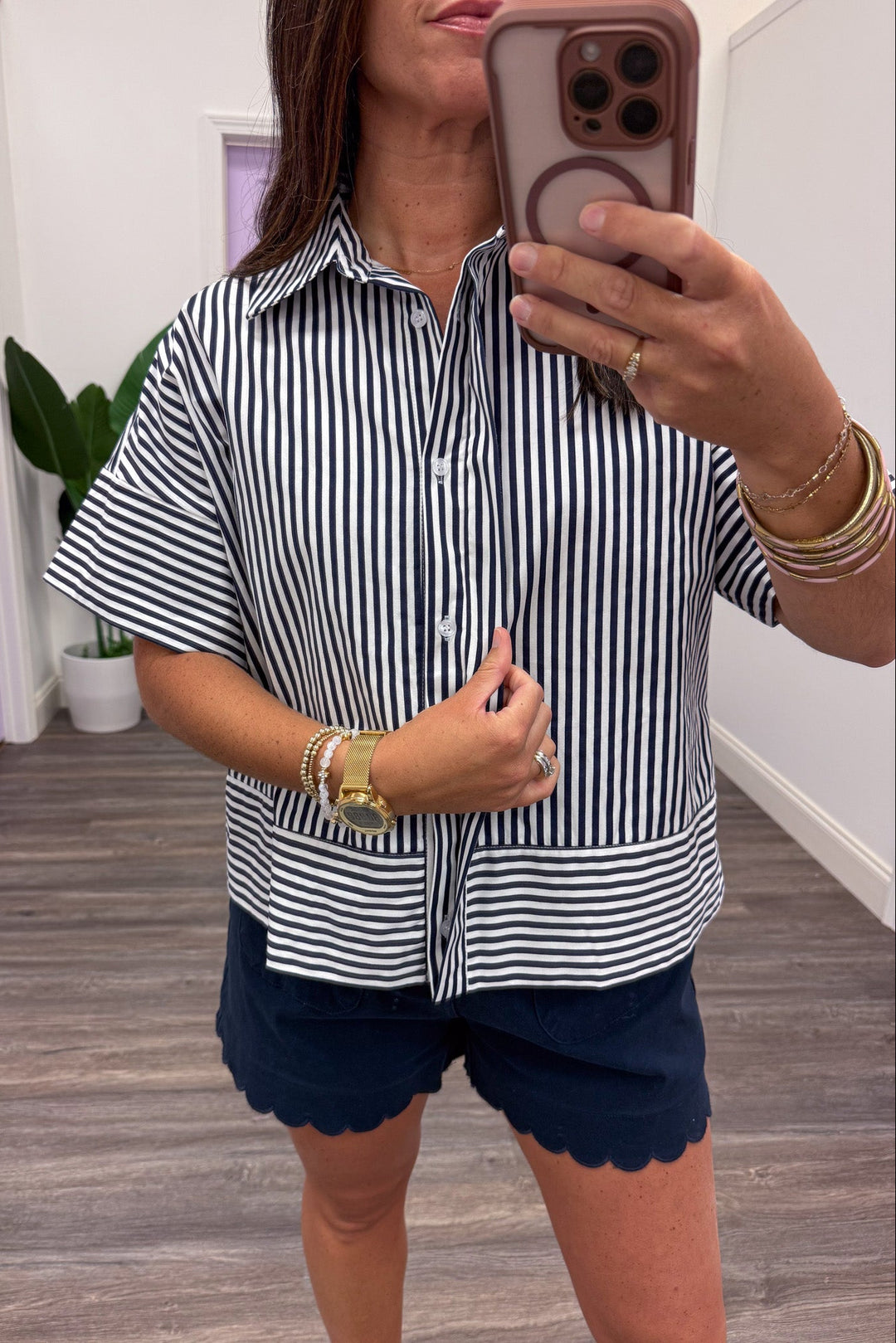 navy and white striped hidden button front crew neckline collared top