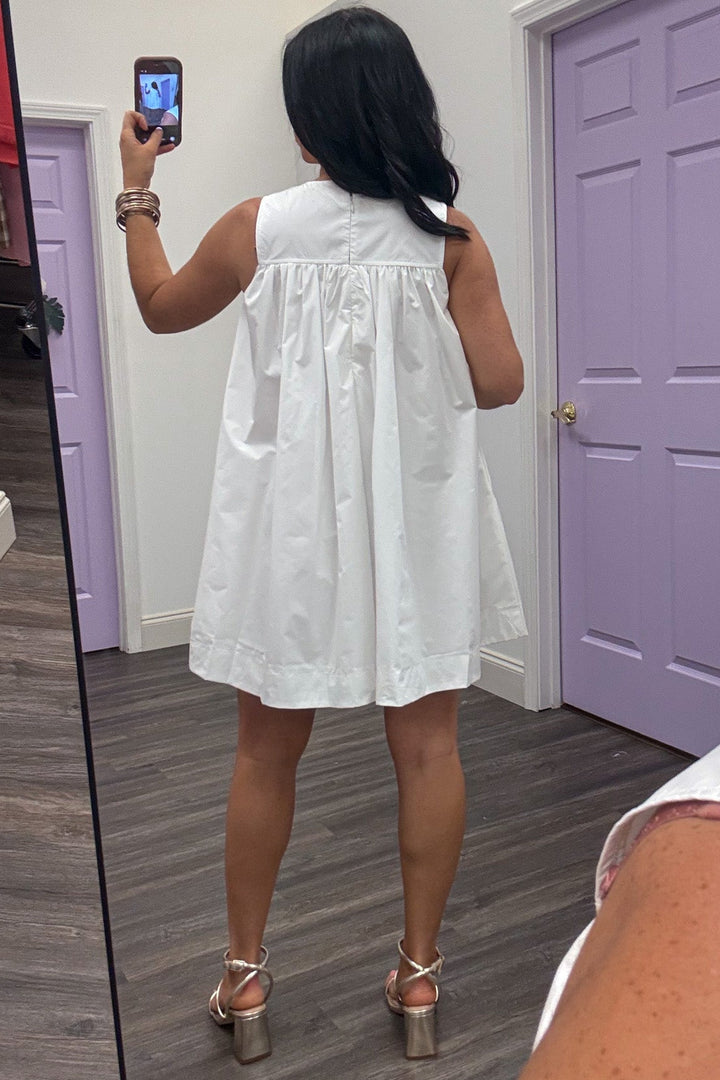 off-white sleeveless mini dress with gathered v bodice detail and back zipper closure