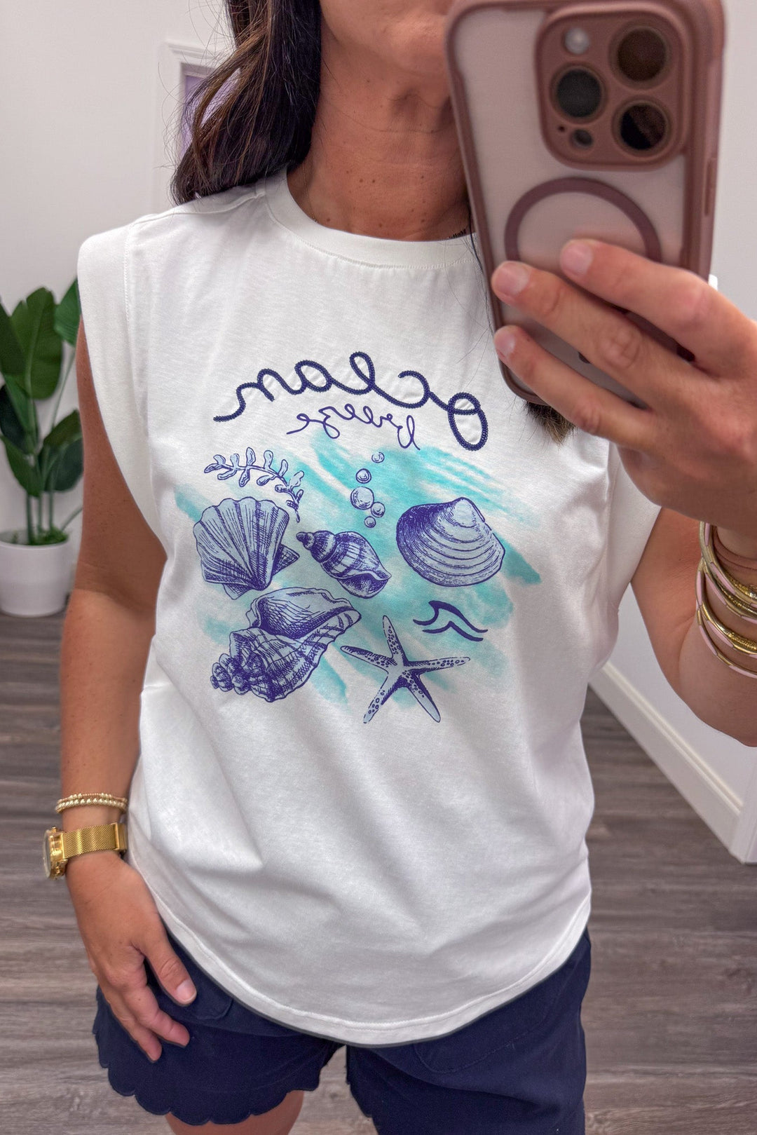 off white teal and blue seashell design graphic tee