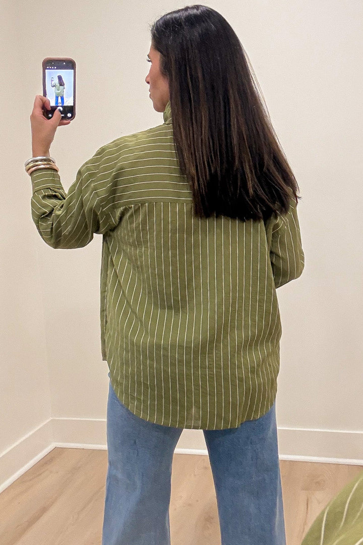 olive green and cream striped mock neck long sleeve flap covered button front top with rounded bottom hem