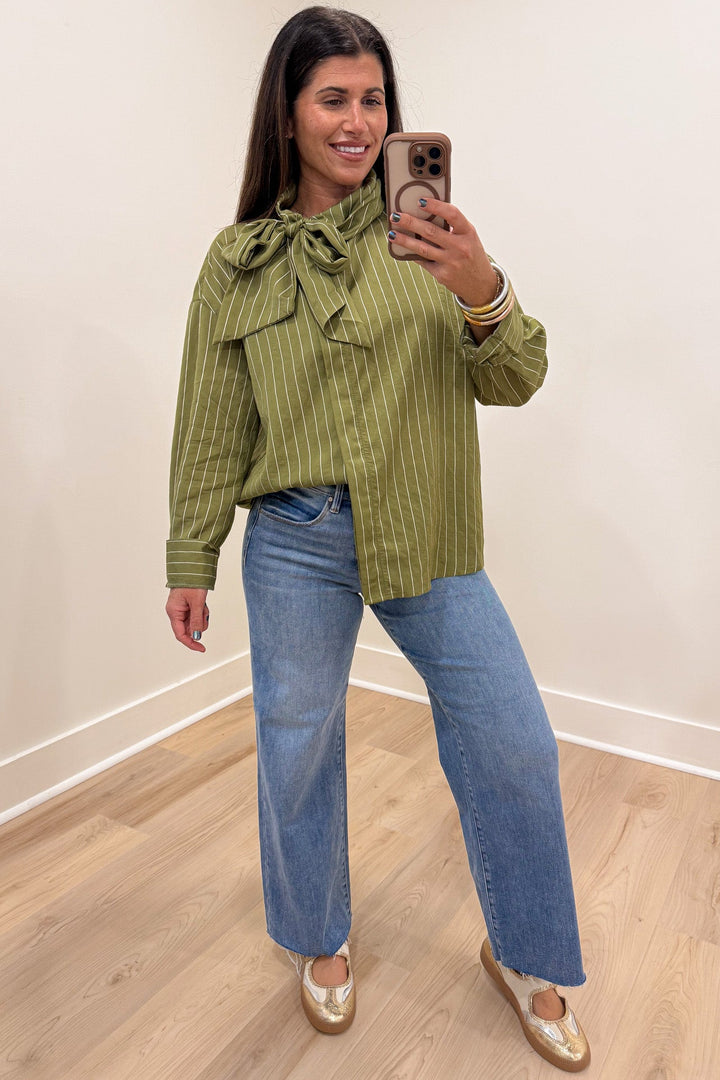 olive green and cream striped mock neck cuffed long sleeve flap covered button front top