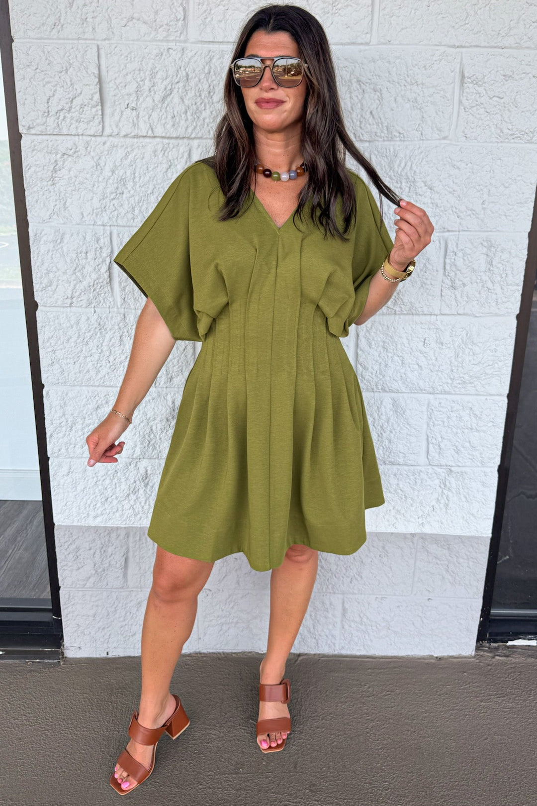 solid olive green dolman sleeve v neckline pleated short dress with pintuck details and side pockets