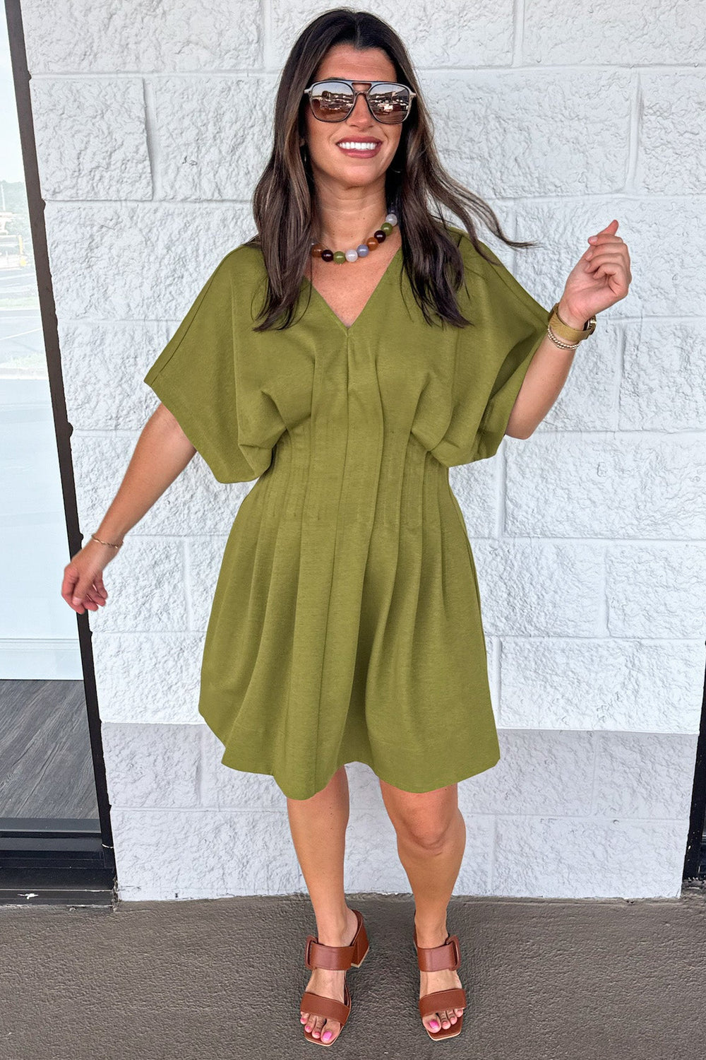 solid olive green dolman sleeve v neckline pleated short dress with pintuck details and gathered waist