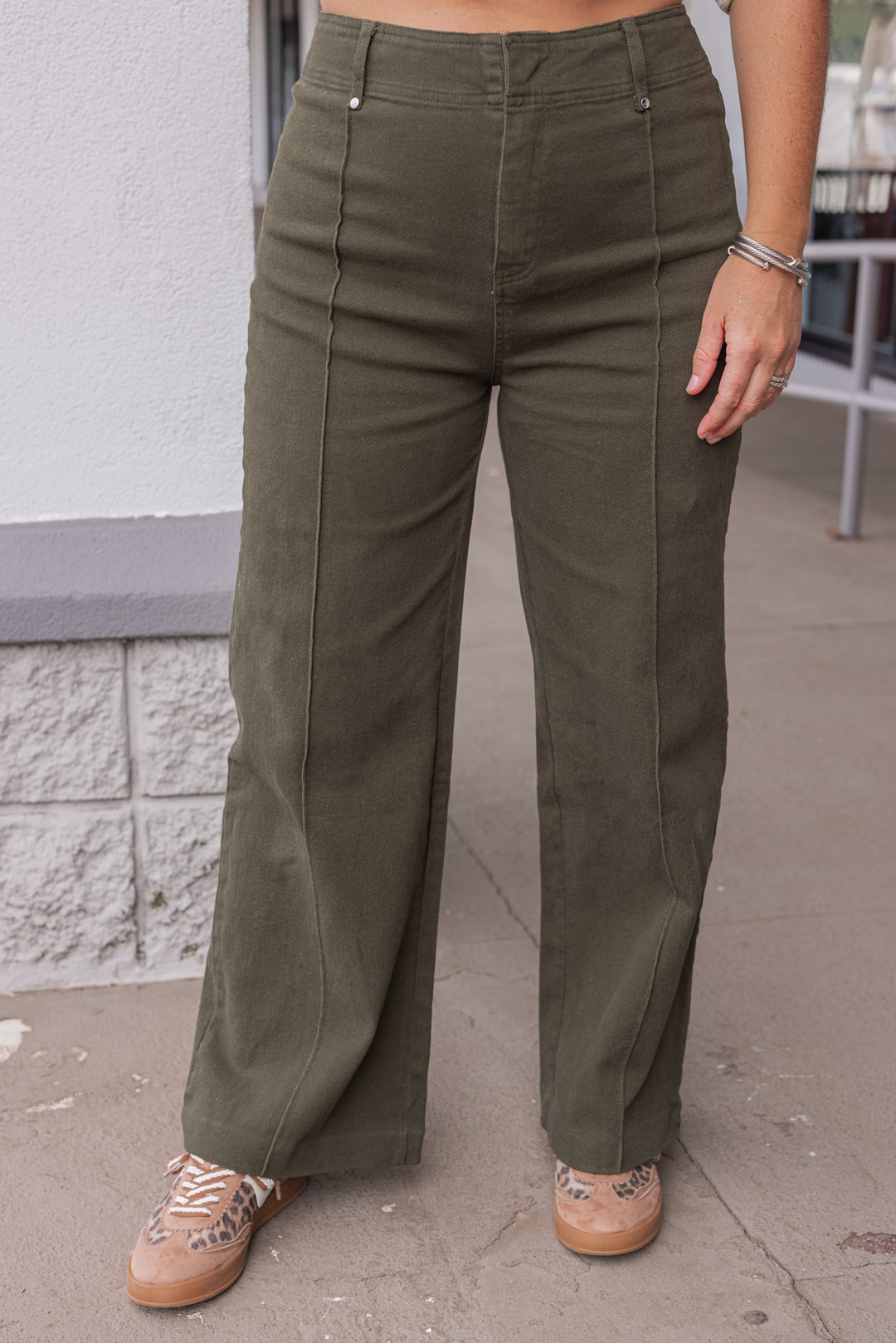 Women's olive denim cropped pants with pintuck seam detail by Entro showing up close front view