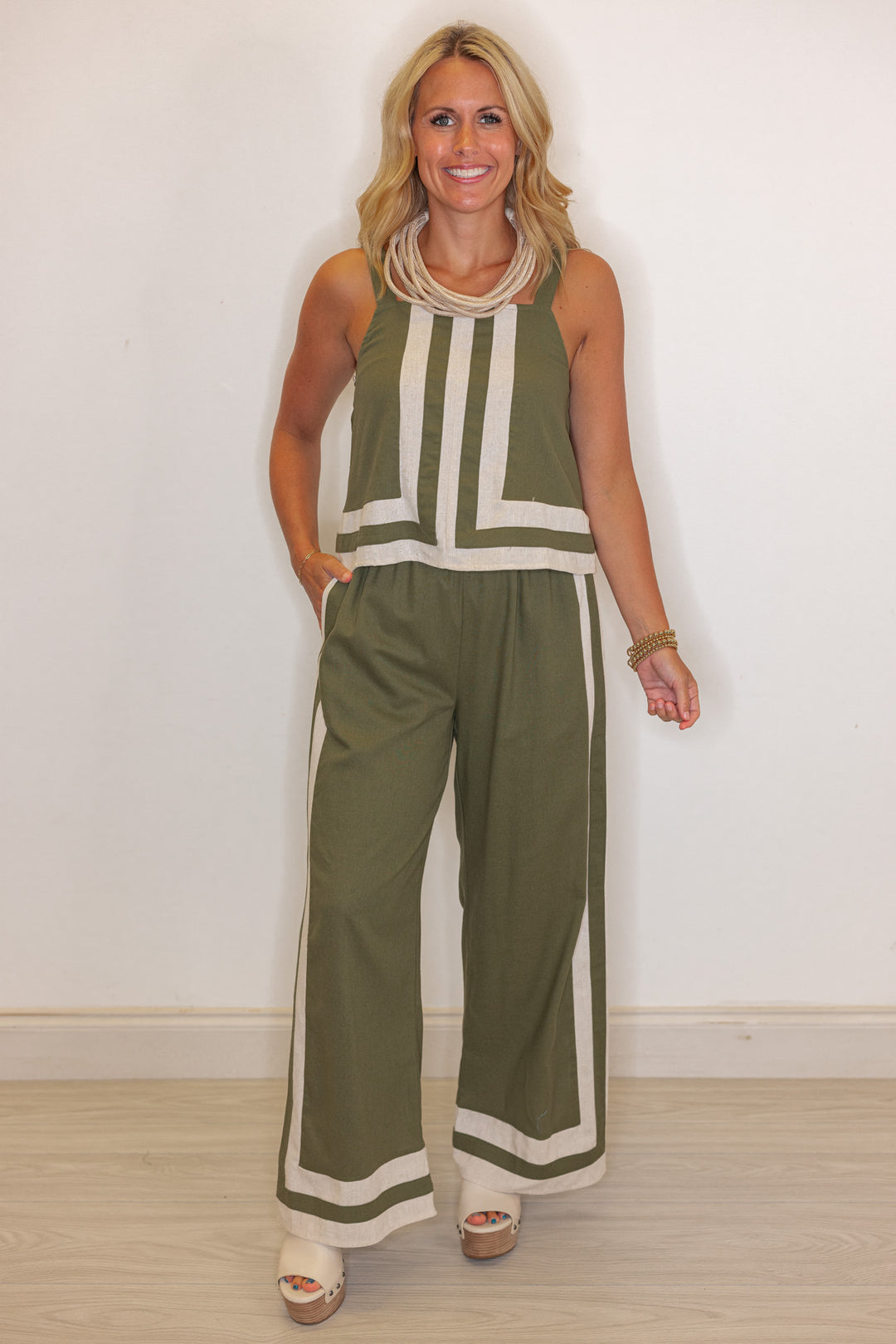 Women's trendy olive green linen sleeveless top with oatmeal trim throughout by Entro