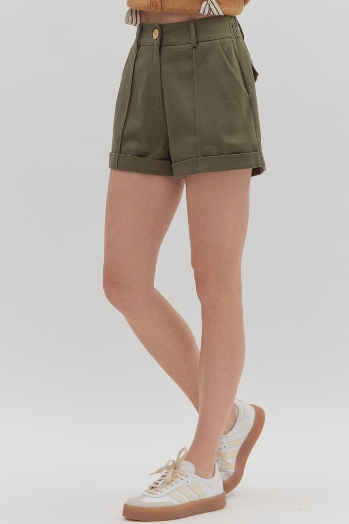 Women's olive denim pintuck shorts by Entro showing slight side view