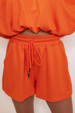 orange elastic waist lounge shorts