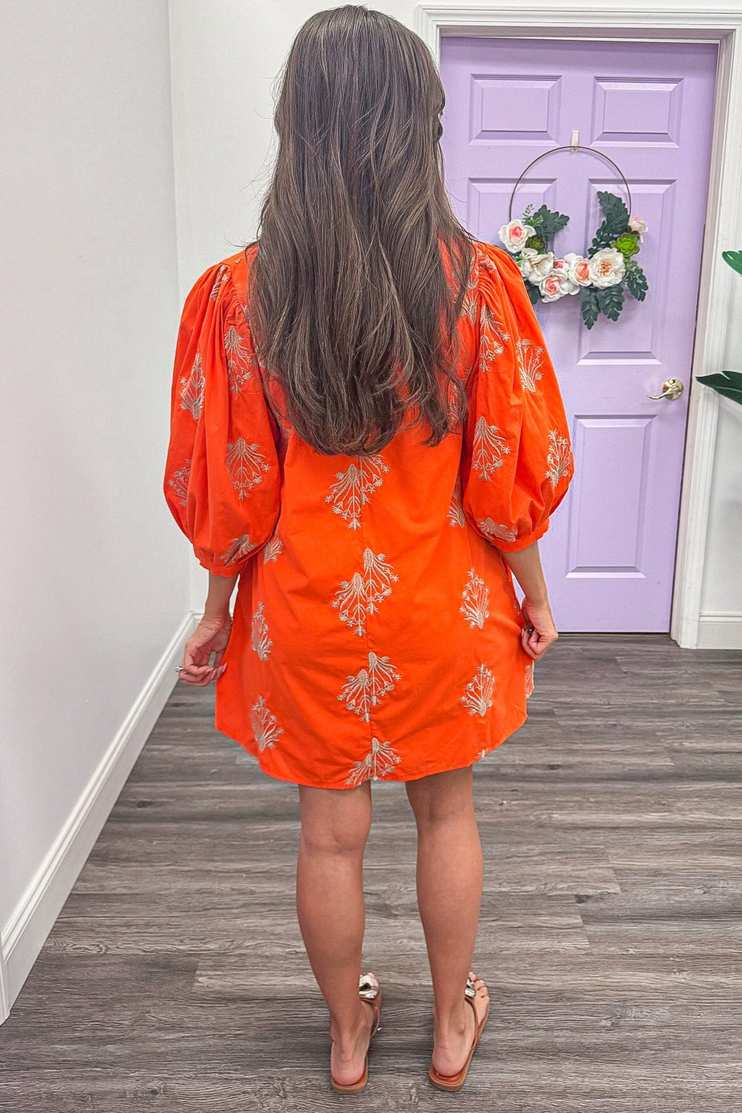 orange balloon sleeve mini dress with gold embroidered floral print