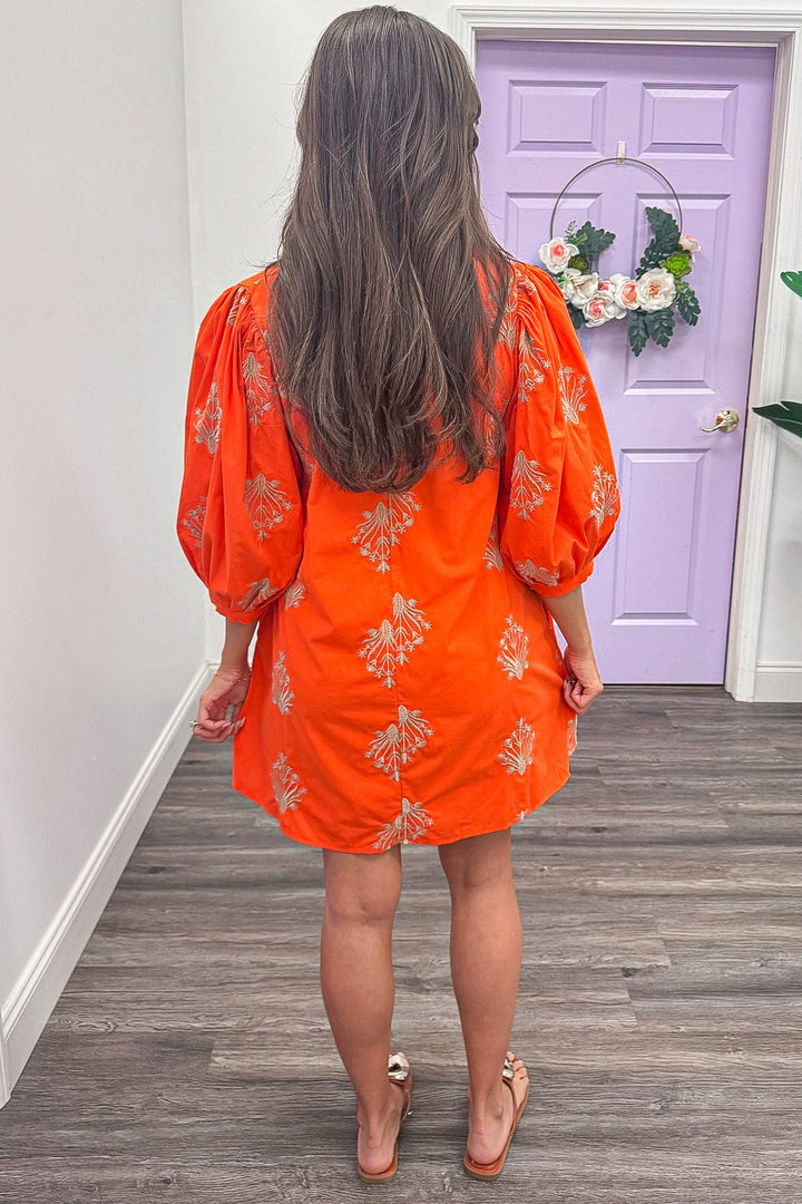 orange balloon sleeve mini dress with gold embroidered floral print