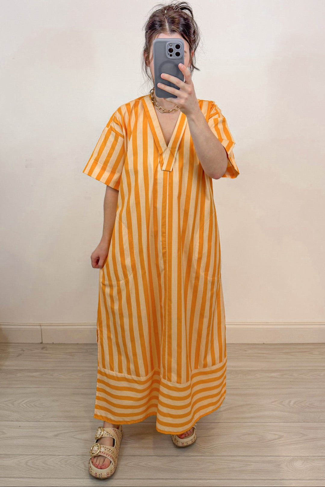 orange and pale peach striped short sleeve v neckline midi dress